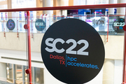 SC22 logo sticker on a glass wall at the conference center