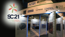 SC21 logo overlaid on photo of DOE's exhibitor booth