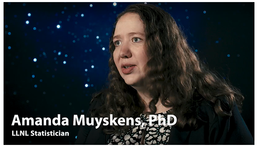 screen shot from video showing Amanda speaking in front of a starry night sky background, overlaid with text of her name and job title