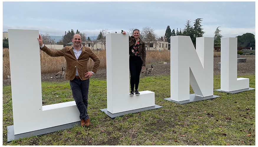 Brian and Cindy pose on the large LLNL letters outside on the Lab’s main campus