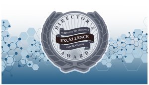 graphic of a medal with the words “director’s science and technology excellence publication award” on a background of blue hexagons