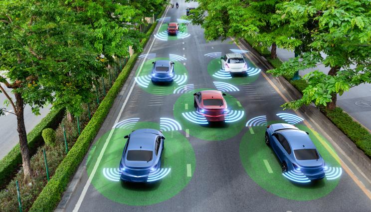 drawing of cars on the road with WiFi signals emanating from them