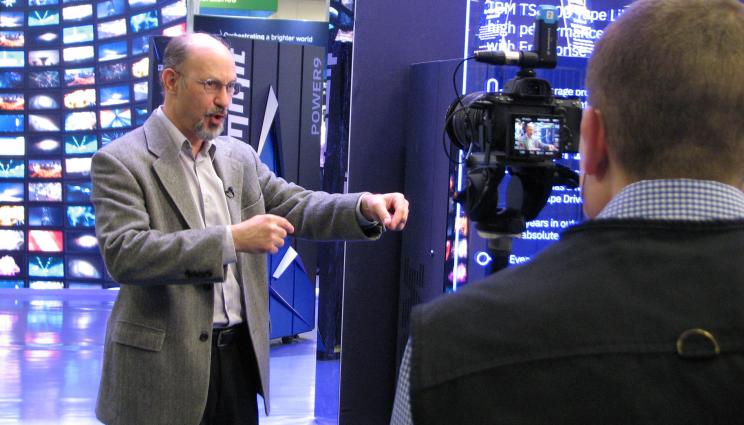 Fred speaking to a camera at the IBM booth